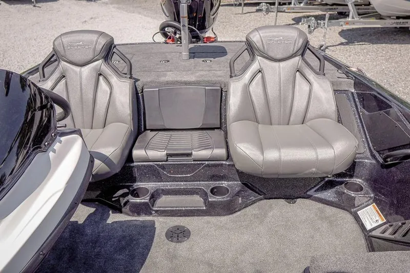 Slide: The Image of 2026 Skeeter ZXR20 SE boat interior with two gray seats and storage compartments. - 23