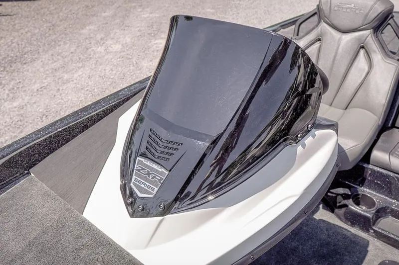 Slide: The Image of 2026 Skeeter ZXR20 SE boat console with sleek black design and comfortable seating. - 24