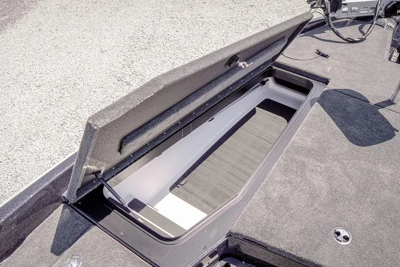 Slide: The Image of Open storage compartment on 2026 Skeeter ZXR20 SE boat deck. - 27