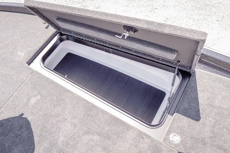 Slide: The Image of Open storage compartment on 2026 Skeeter ZXR20 SE boat deck. - 30