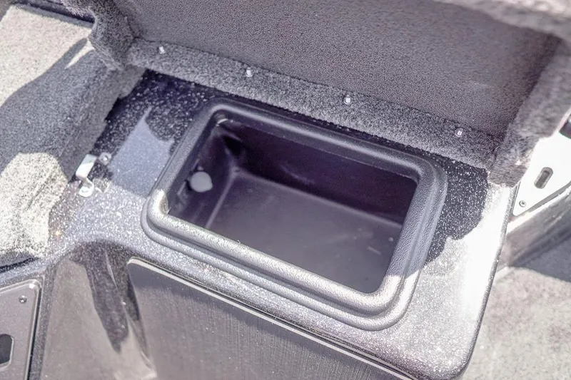 Slide: The Image of Open storage compartment in 2026 Skeeter ZXR20 SE boat, featuring a durable interior. - 33