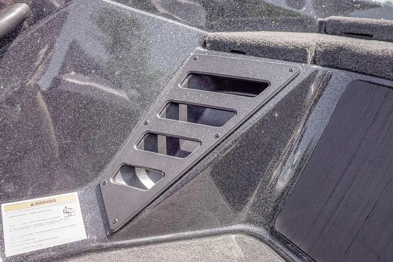 Slide: The Image of 2026 Skeeter ZXR20 SE boat interior detail with sleek design and warning label. - 34