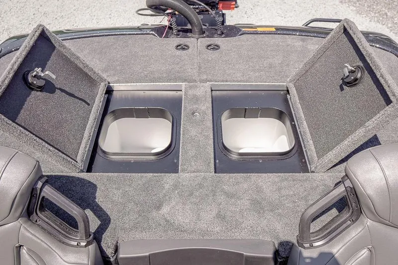 Slide: The Image of 2026 Skeeter ZXR20 SE boat deck with open storage compartments and seating. - 36