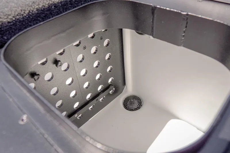 Slide: The Image of 2026 Skeeter ZXR20 SE boat compartment with drainage and perforated metal panel. - 37