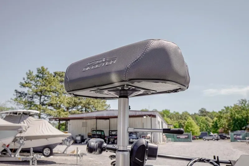 Slide: The Image of Seat of 2026 Skeeter ZXR20 SE boat, outdoor setting with trees and buildings. - 42