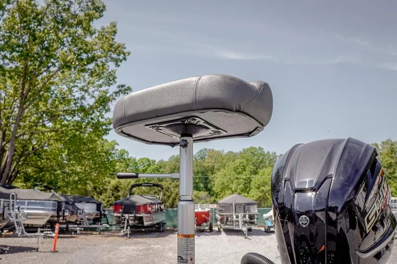 Slide: The Image of 2026 Skeeter ZXR20 SE boat seat and motor in a marina setting. - 43