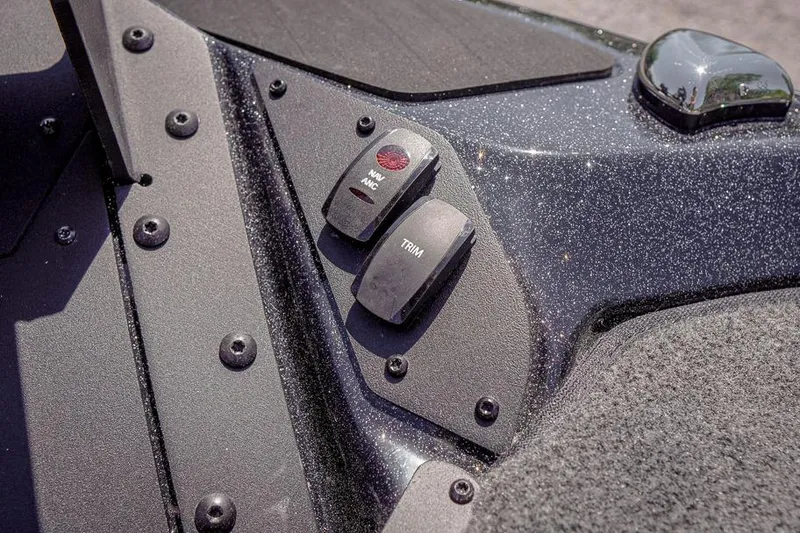Slide: The Image of Control panel of 2026 Skeeter ZXR20 SE boat with trim and nav switches. - 46