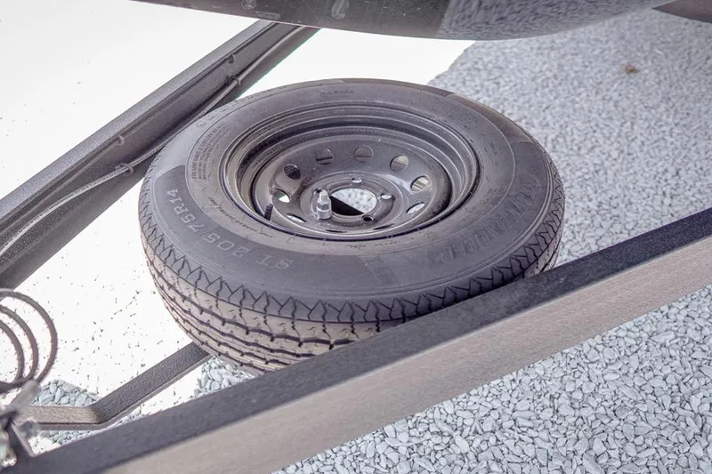 Slide: The Image of Spare tire mounted on a 2026 Skeeter ZXR20 SE trailer frame. - 52
