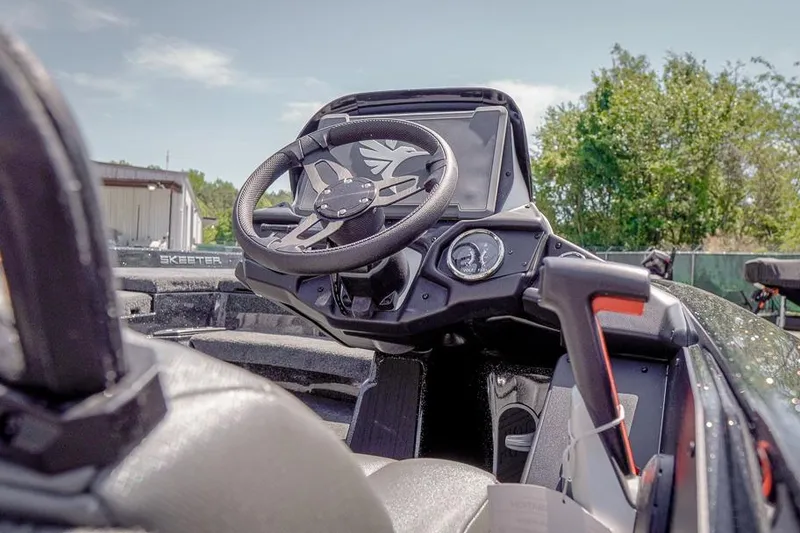 Slide: The Image of 2026 Skeeter ZXR20 SE boat cockpit with modern steering wheel and dashboard controls. - 7