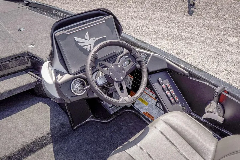 Slide: The Image of 2026 Skeeter ZXR20 SE boat cockpit with steering wheel and control panel. - 8