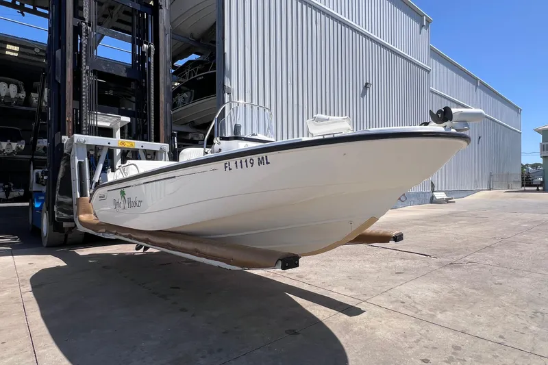 Slide: The Image of 2004 Boston Whaler 180 Dauntless boat docked, featuring Minn Kota trolling motor. - 3