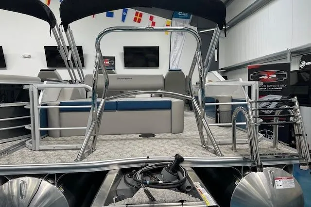 Slide: The Image of 2025 Berkshire 24UL LE B pontoon boat with sleek design in showroom setting. - 10