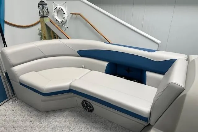 Slide: The Image of Luxurious seating on a 2025 Berkshire 24UL LE B pontoon boat, featuring elegant blue and white upholstery. - 3