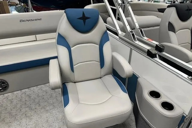 Slide: The Image of Luxury seating on 2025 Berkshire 24UL LE B pontoon boat, featuring blue and gray upholstery. - 4