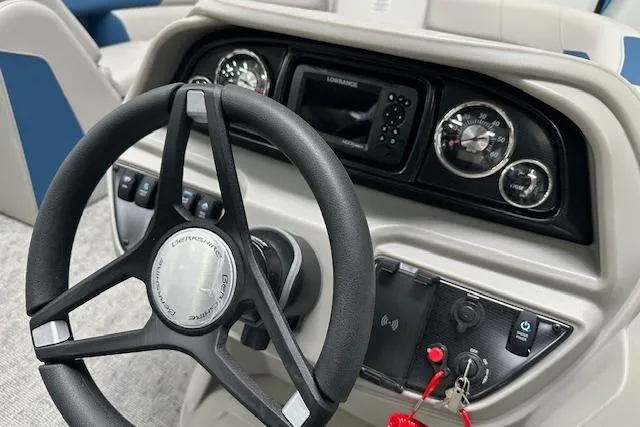 Slide: The Image of Steering console of 2025 Berkshire 24UL LE B boat with gauges and controls. - 7