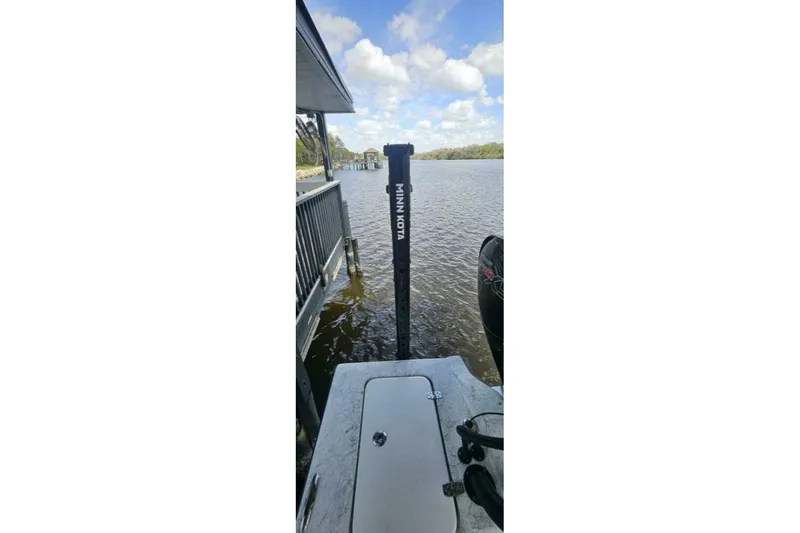 Slide: The Image of Docked 2021 Flats Cat 21' boat with Minn Kota motor on a sunny day. - 10