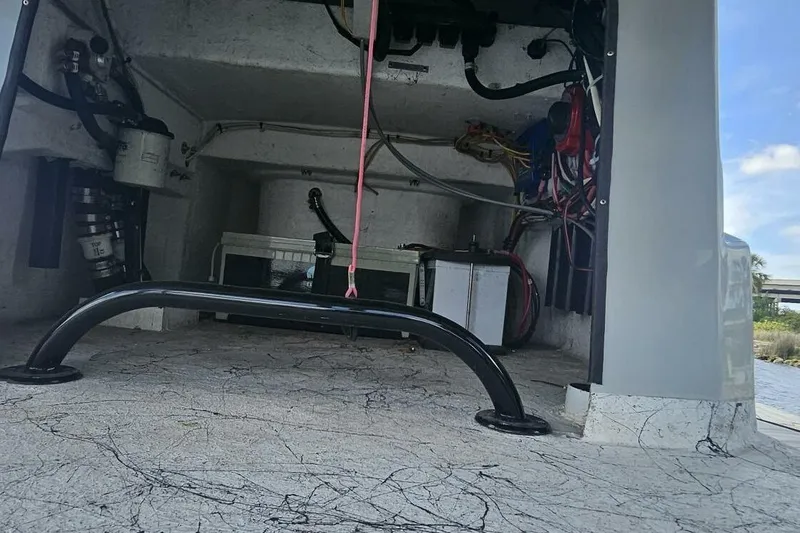 Slide: The Image of Interior view of a 2021 Flats Cat 21' boat showing wiring and equipment. - 13