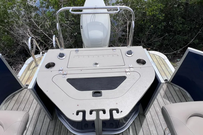Slide: The Image of 2018 Berkshire 25 STS Tri Toon boat deck with seating and storage compartments. - 16