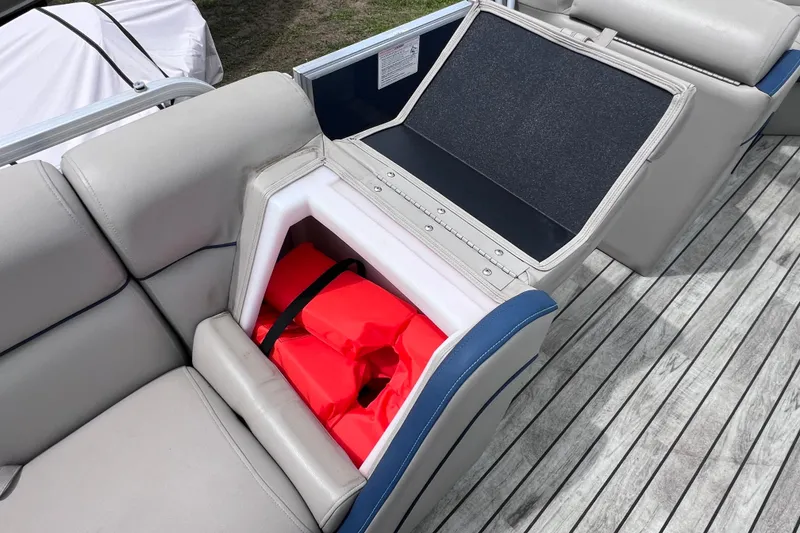 Slide: The Image of 2018 Berkshire 25 STS Tri Toon boat seat storage with life jackets. - 20