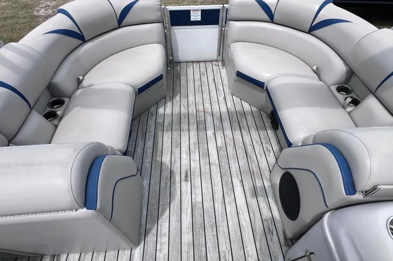Slide: The Image of Luxurious seating on 2018 Berkshire 25 STS Tri Toon boat with wood-style flooring. - 27