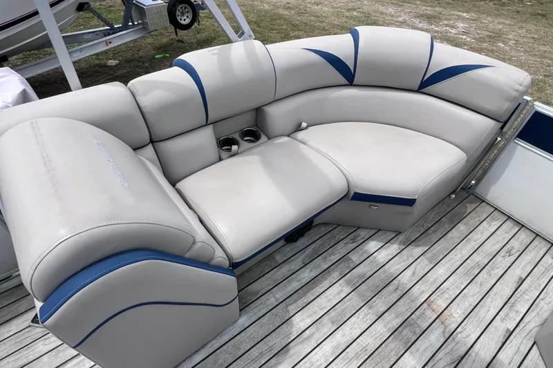 Slide: The Image of Luxurious seating on 2018 Berkshire 25 STS Tri Toon boat with cup holders. - 31