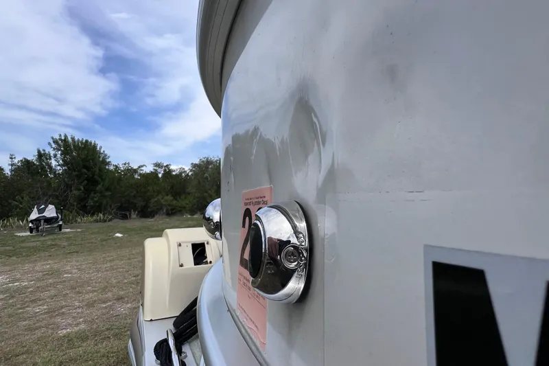 Slide: The Image of 2018 Berkshire 25 STS Tri Toon boat detail with chrome fixture and sticker. - 35