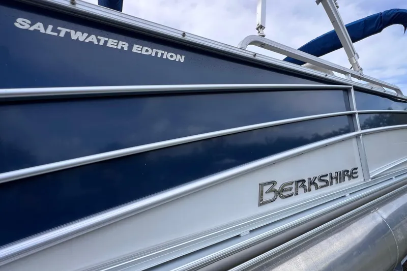 Slide: The Image of 2018 Berkshire 25 STS Tri Toon Saltwater Edition boat, side view with logo. - 5
