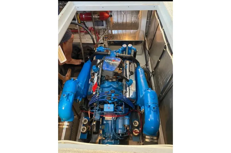 Slide: The Image of Engine compartment of a 1991 Silverton 41 Motor Yacht with blue Crusader engine. - 60