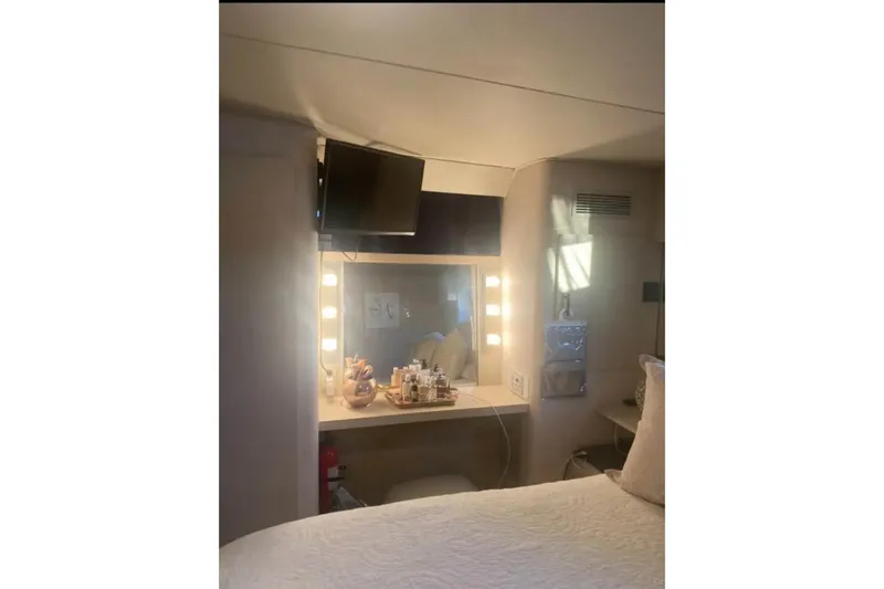Slide: The Image of Interior of 1991 Silverton 41 Motor Yacht with vanity and TV. - 77