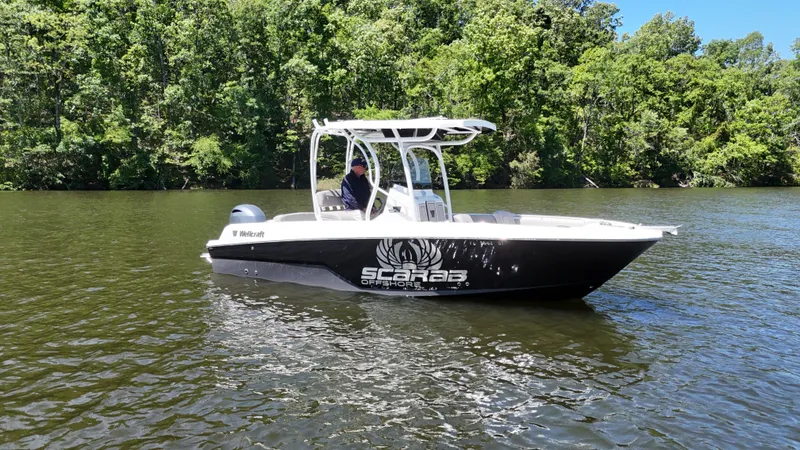 Slide: The Image of 2020 Wellcraft Scarab Offshore boat on a calm river. - 19