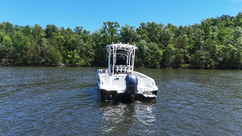 Slide: The Image of 2020 Wellcraft Scarab Offshore boat on a serene lake. - 21