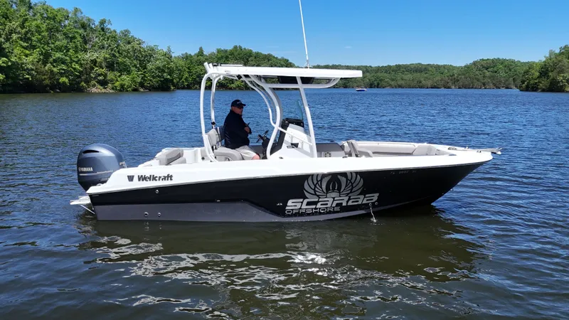 Slide: The Image of 2020 Wellcraft Scarab Offshore boat on a calm lake. - 25
