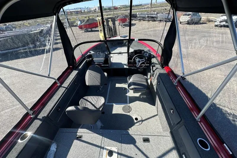Slide: The Image of Interior view of 2026 Starweld 17 SXT boat with seating and steering console. - 4