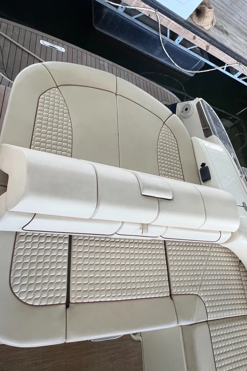 Slide: The Image of 2020 Chris-Craft Launch 31 GT boat interior seating with beige upholstery. - 28