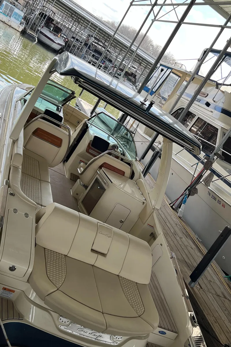 Slide: The Image of 2020 Chris-Craft Launch 31 GT boat docked in a marina. - 30