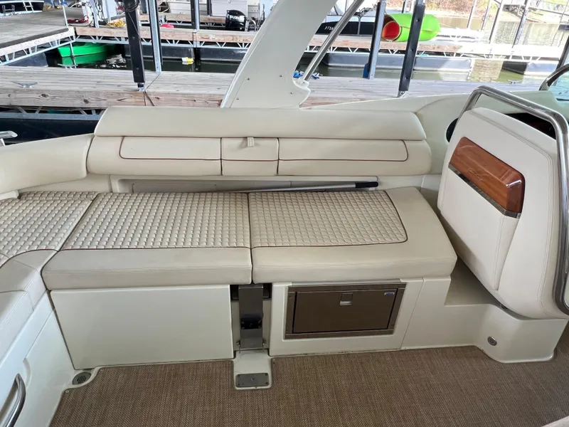Slide: The Image of 2020 Chris-Craft Launch 31 GT interior seating area with storage compartments. - 31