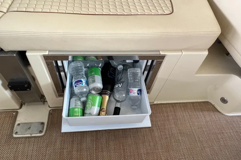 Slide: The Image of Built-in cooler drawer on 2020 Chris-Craft Launch 31 GT boat with drinks. - 36