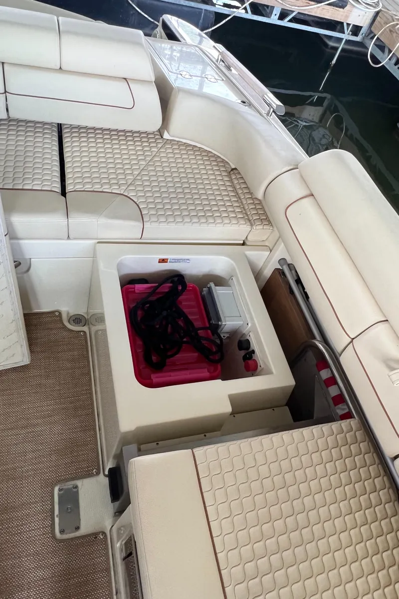 Slide: The Image of 2020 Chris-Craft Launch 31 GT interior with cushioned seating and storage compartment. - 41