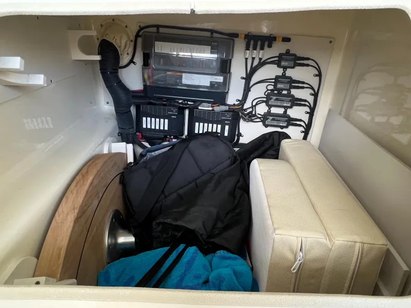 Slide: The Image of 2020 Chris-Craft Launch 31 GT storage compartment with electrical components and gear. - 46