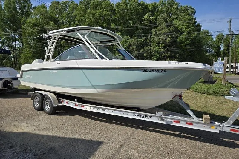 The Image of 2020 Boston Whaler 270 Vantage boat on trailer, parked outdoors. - 1