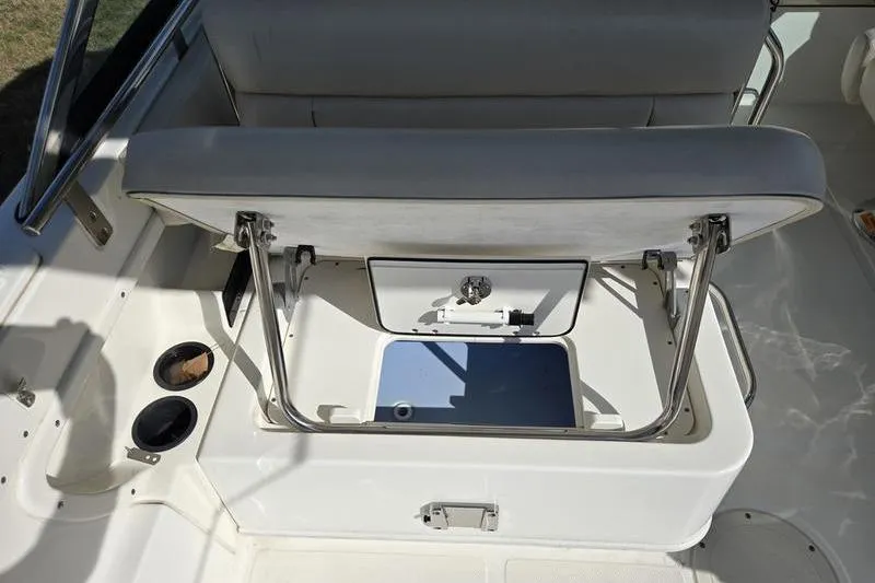 Slide: The Image of 2020 Boston Whaler 270 Vantage boat seat with open storage compartment. - 10