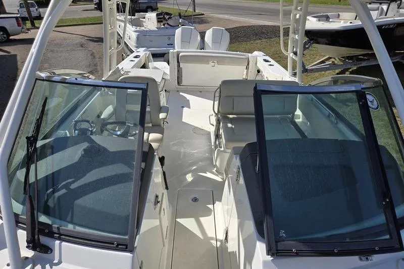 Slide: The Image of 2020 Boston Whaler 270 Vantage boat interior with seating and windshield view. - 19