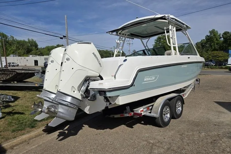Slide: The Image of 2020 Boston Whaler 270 Vantage boat on trailer, featuring dual Mercury engines. - 3