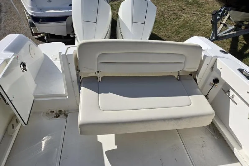 Slide: The Image of 2020 Boston Whaler 270 Vantage boat with rear seating and dual engines. - 6