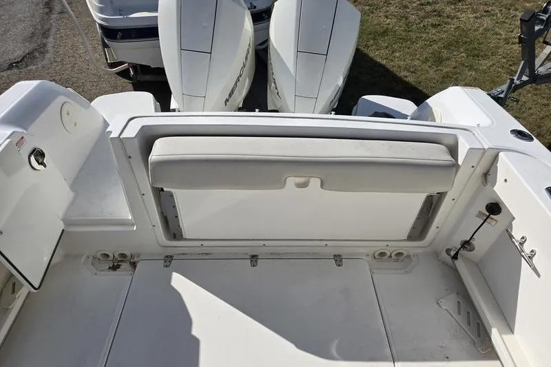 Slide: The Image of 2020 Boston Whaler 270 Vantage boat interior with seating and dual Mercury engines. - 7