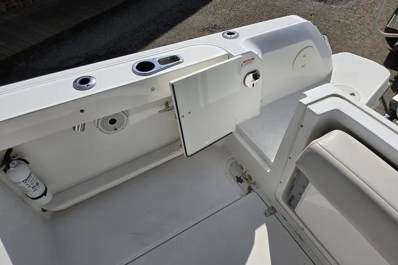 Slide: The Image of 2020 Boston Whaler 270 Vantage boat interior with storage compartment and seating. - 9