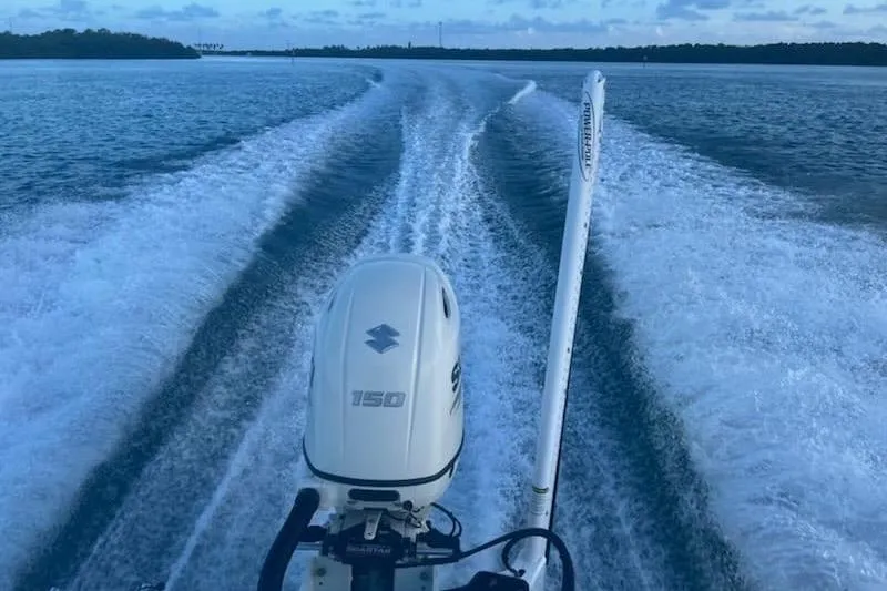 Slide: The Image of 2020 Sea Pro 219 Center Console boat cruising on open water, leaving a wake. - 13