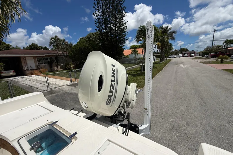 Slide: The Image of 2020 Sea Pro 210 Center Console boat with Suzuki outboard motor on a sunny street. - 14