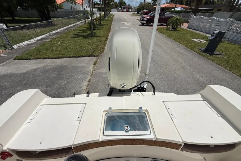 Slide: The Image of 2020 Sea Pro 210 Center Console boat with outboard motor on a residential street. - 15