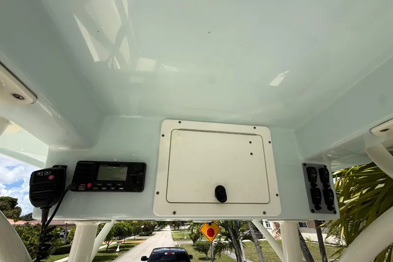 Slide: The Image of 2020 Sea Pro 210 Center Console boat dashboard with radio and control panel. - 26